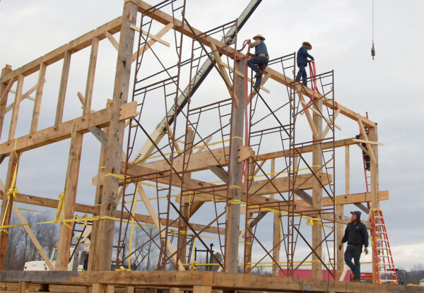 Legacy Barns employs Amish timber-wrights to assist with raising their barns in the traditional manner.